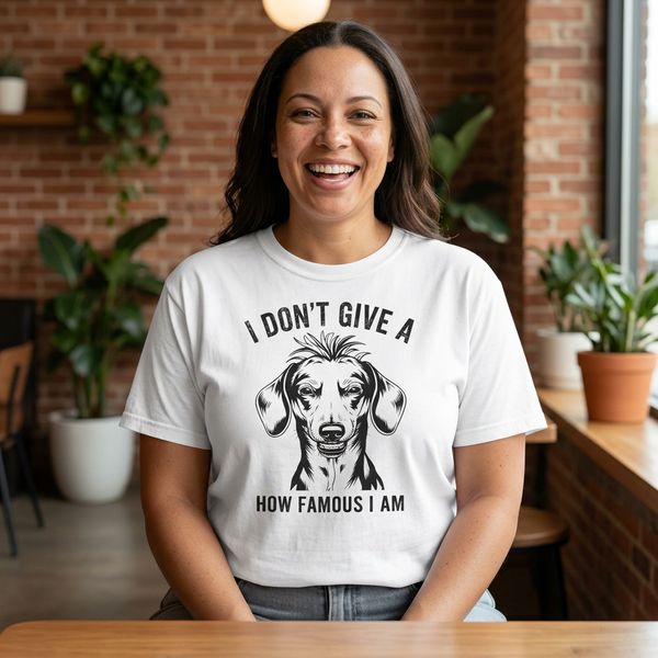 Woman wearing I Don't Give a How Famous I Am funny dachshund t-shirt — Unhinged Collection by Doxie League