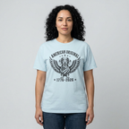 Woman wearing chambray blue Comfort Colors t-shirt with 
American Original dachshund eagle wings 250th anniversary 
graphic design in black print